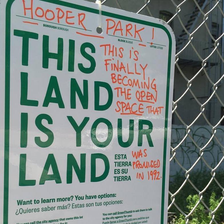 596 Acres sign on fence at Hooper Park in southside Williamsburg