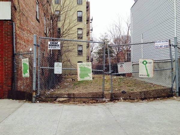 Bronx fence with signs